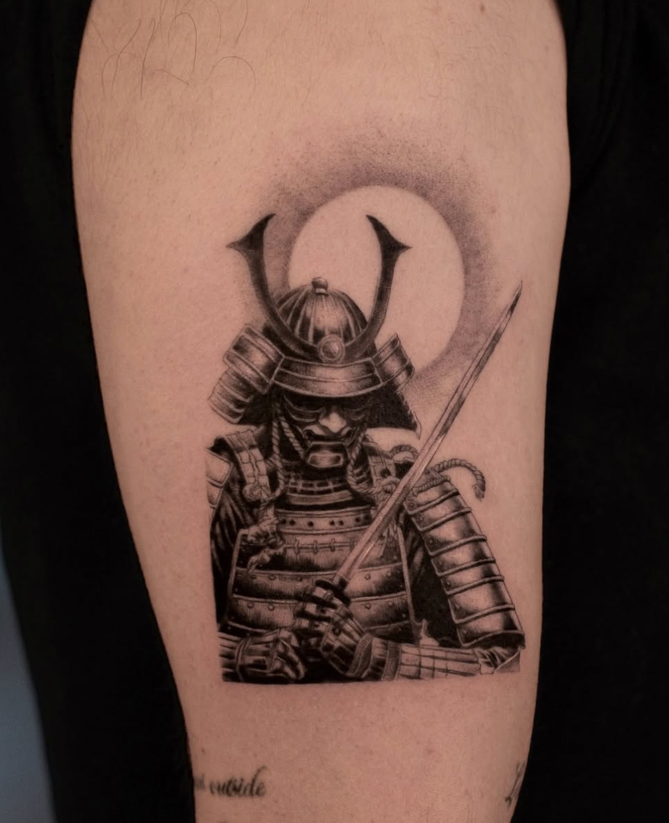 portrait of a samurai as a tattoo in realism on white skin