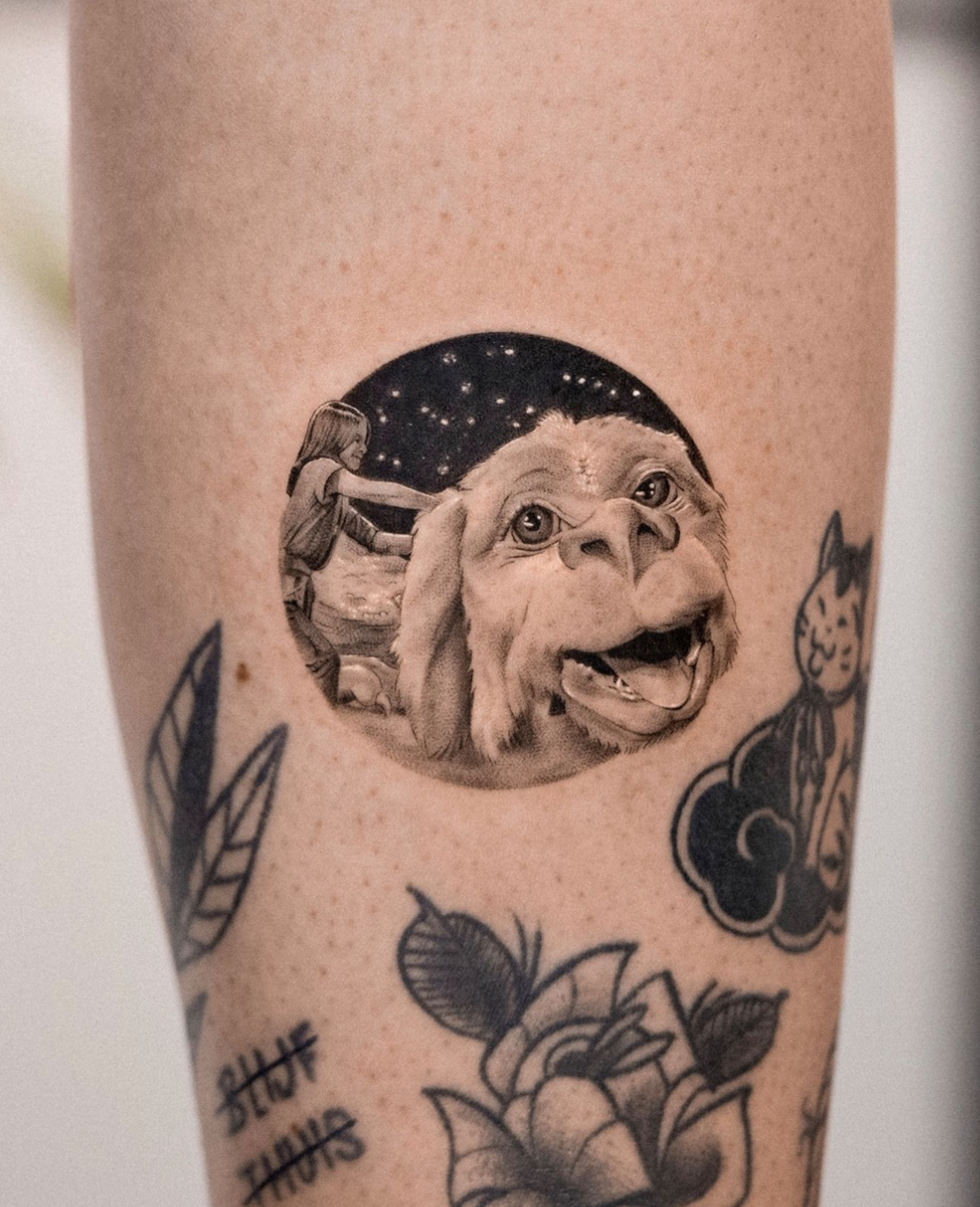 never ending story realistic black and grey tattoo on white skin
